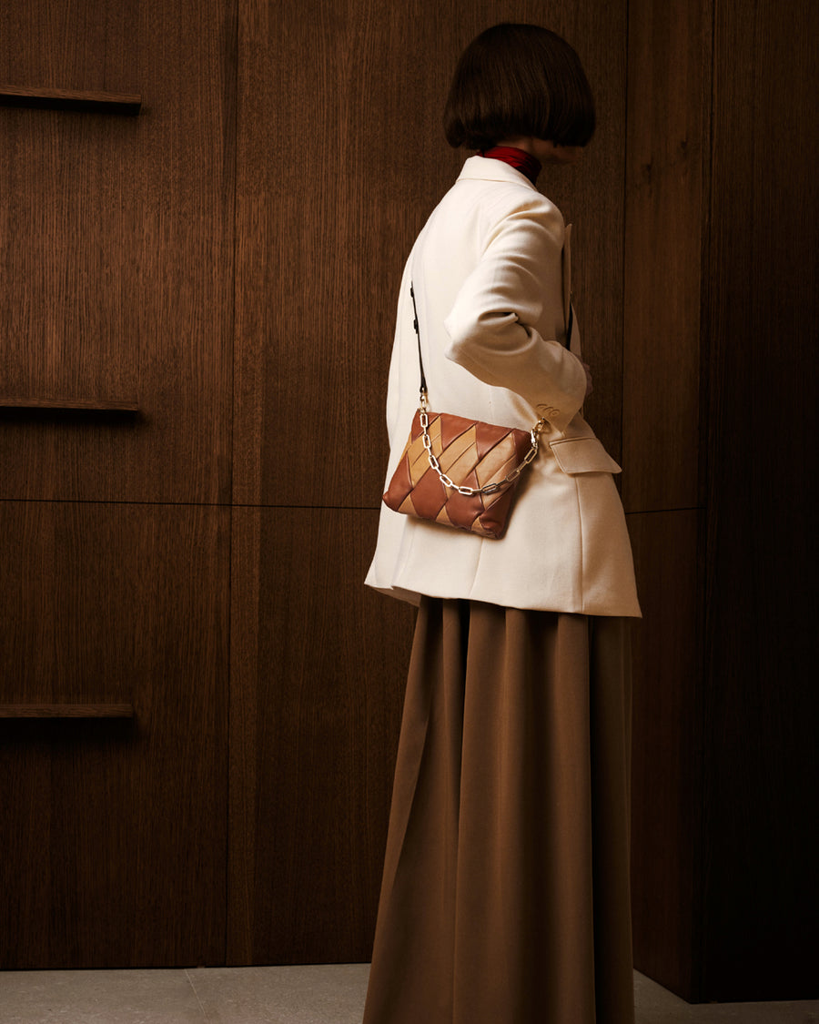 RECO Crossbody pouch bag CUBO crafted from brown and beige paneled leather from upcycled and sustainable materials from Spain and Italian leather