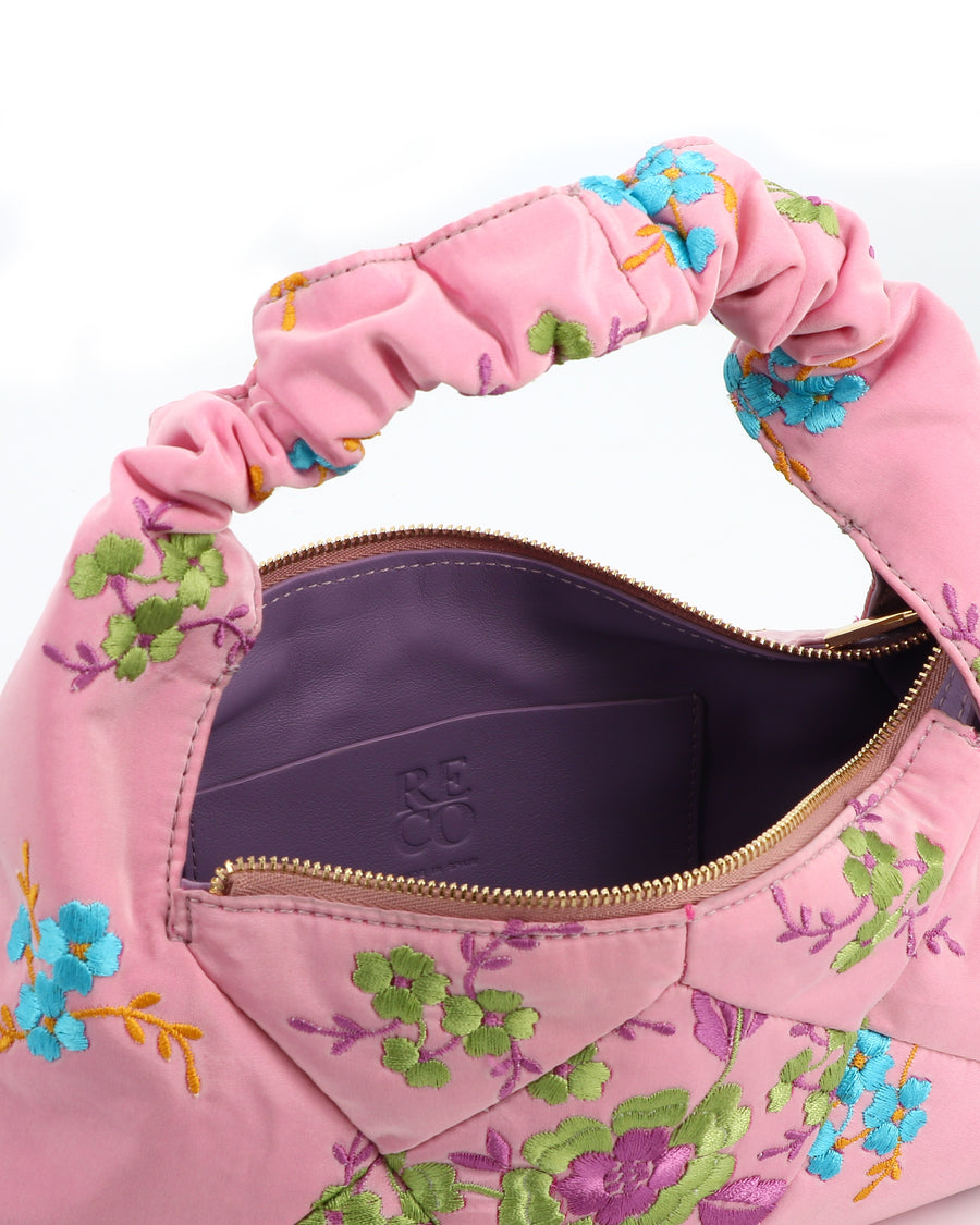 RECO handbag DIDI HOBO crafted from pastel pink embroidered satin showing inside capacity lined in leather with a patch interior pocket and fastening closing 