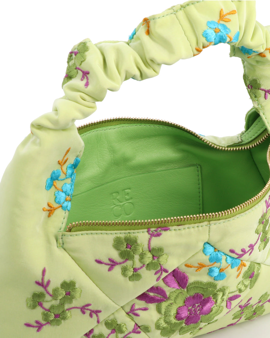 RECO handbag DIDI HOBO crafted from pastel green embroidered satin showing inside capacity lined in leather with a patch interior pocket and fastening closing 