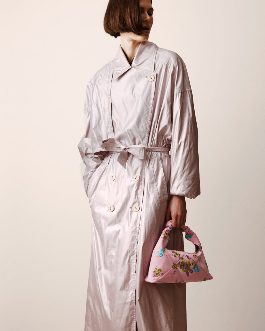 RECO handbag DIDI HOBO crafted from pastel pink embroidered satin worn by a woman as a pouch under her arm