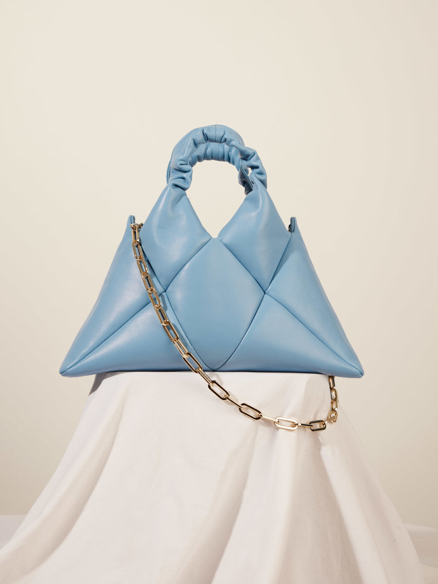 Light blue leather handbag with golden chain