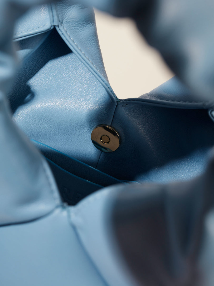 Interior of a light blue leather handbag
