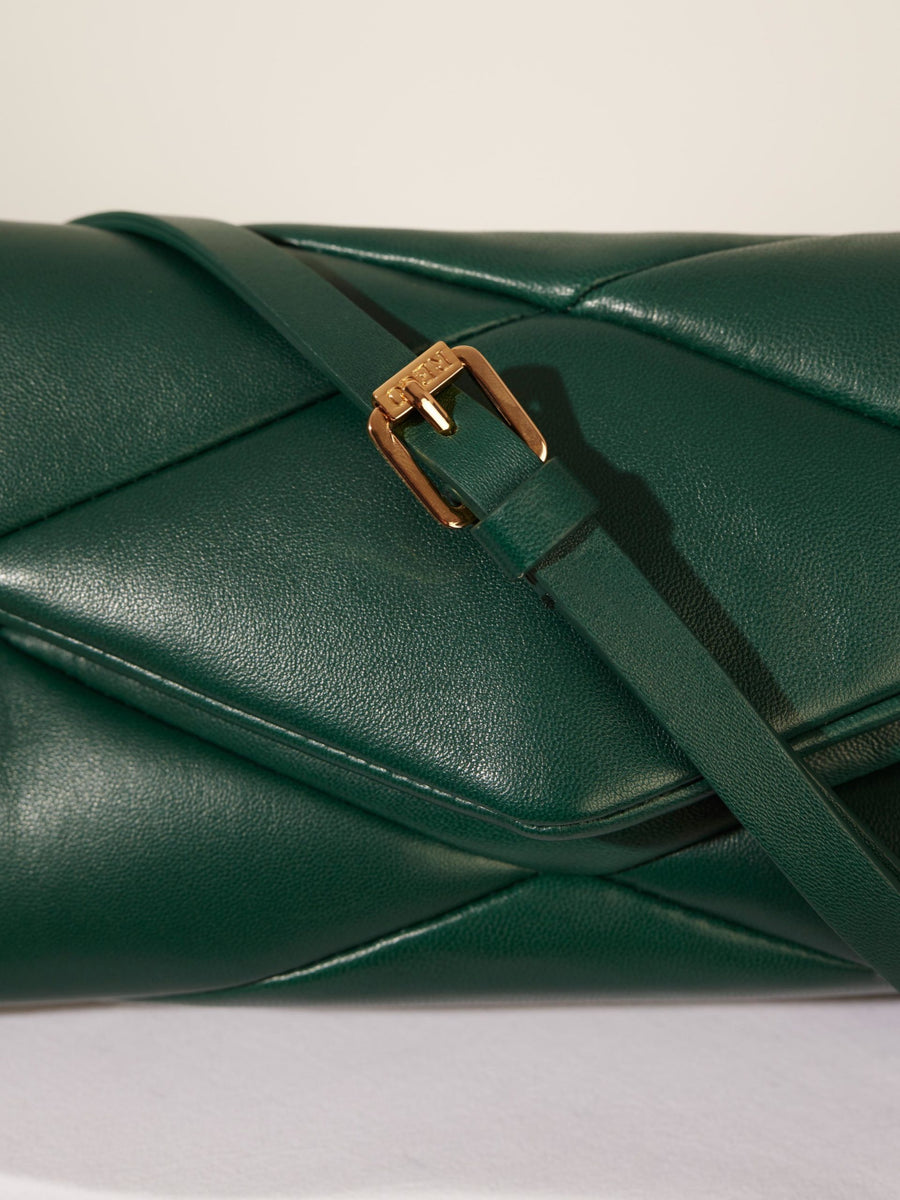 Dark green leather handbag with golden buckle