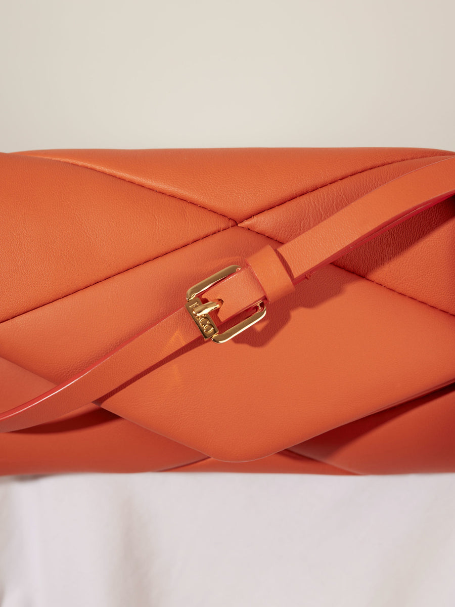 Orange leather handbag with golden buckle