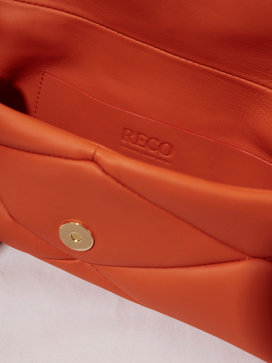 Interior of an orange leather handbag