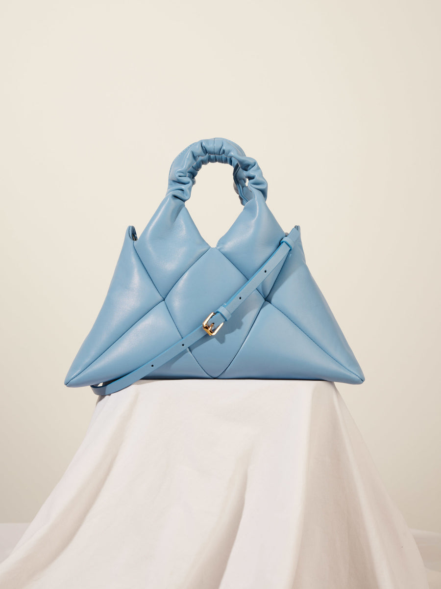 Light blue leather handbag with golden buckle